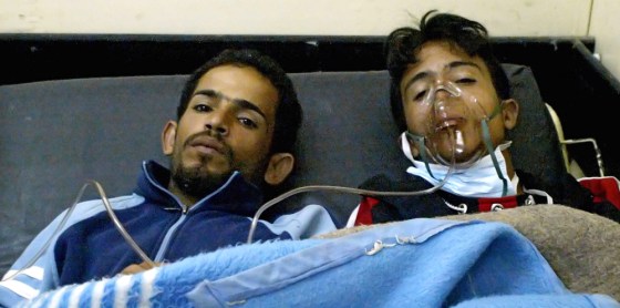 Wounded Iraqis rest at a hospital in Bag