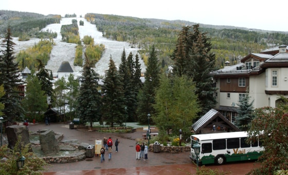 The ski slopes of Vail Mountain, Colo. are shown covered with light snow. Climate change is an increasing threat and concern for ski resorts.