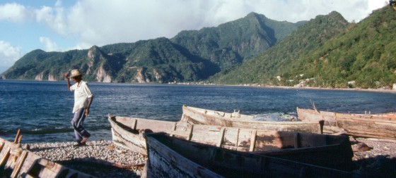 A fisherman walks on Soufriere Bay in Dominica. This jagged, densely rainforested island, about 29 miles long and 16 miles wide, is located between Guadeloupe and Martinique in the Eastern Caribbean, 375 miles southeast of San Juan, Puerto Rico. 