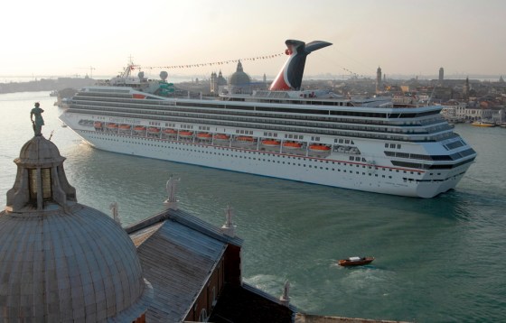 The new Carnival Freedom sails by San Giorgio Maggiore church in Venice, Italy