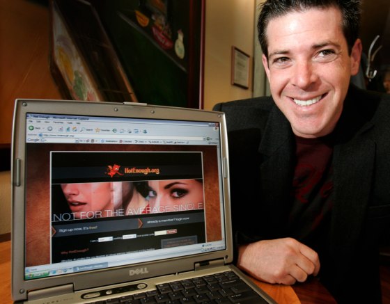 Jason Pellegrino, 33, who runs a dating website called "HotEnough.org" poses with the site's home page in South Orange, N.J., Tuesday, March 6, 2007. Prospective members of the website must submit pictures and must be rated an 8 or higher by people already in the club. Once they're in, they are permitted to e-mail other "hotties" for $9.95 a month.