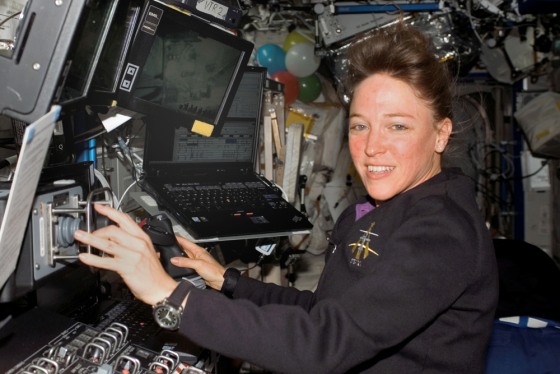 Former astronaut Lisa Nowak, shown here during last July's flight of the shuttle Discovery, has been given the job of developing flight lesson plans for the U.S. Navy. NASA fired Nowak, a Navy captain, after she was arrested on suspicion of assaulting a romantic rival.