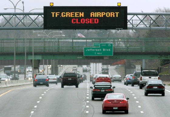 A highway sign on Interstate-95 southbound alerts motorists of the closure of T.F. Green Airport in Warwick, R.I. The airport was closed after a temporary construction wall collapsed under pressure from the high winds associated with the spring storm that hit the East Coast.