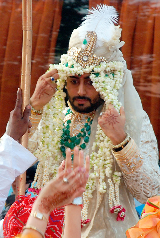 Bollywood star Bachchan rides a horse as he arrives for his wedding in Mumbai