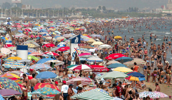 Crowds flock to a beach in Valencia. Spain's third-largest city will have it's time in the spotlight when it hosts the 32nd America's Cup.