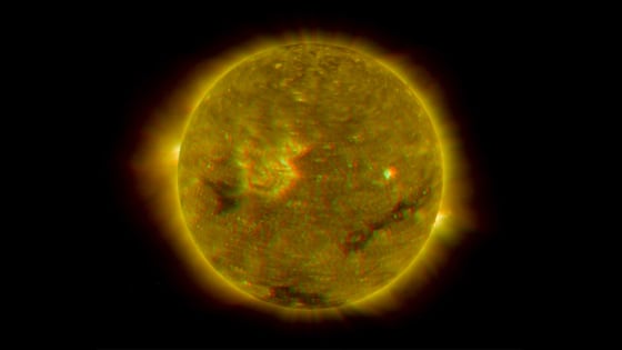 Data from the twin STEREO spacecraft in four different wavelengths were combined to create this image of the sun’s disk. The image’s colors have been enhanced to produce a three-dimensional effect when viewed with red-blue glasses.