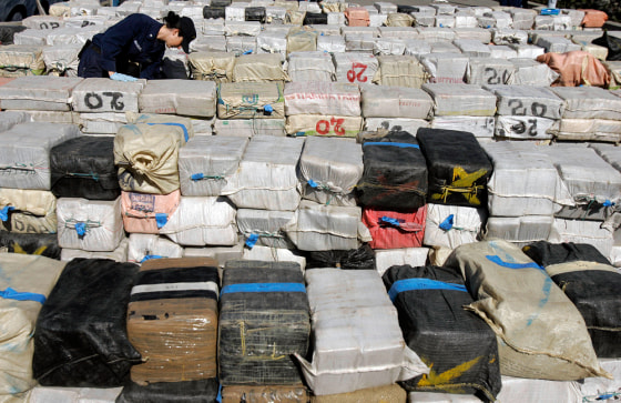 U.S. Coast Guard Petty Officer 3rd Class Danielle Desvergers looks through some of the more than 40,000 pounds of cocaine — worth an estimated $500 million — offloaded from Coast Guard Cutter Sherman at Coast Guard Island in Alameda, Calif., on Monday.