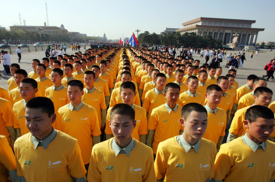 Chinese soldiers prepare to take part in a mass run held to mark 500 days until the opening of the 2008 Beijing Olympic Games, in Beijing's Tiananmen Square Sunday March 25, 2007.