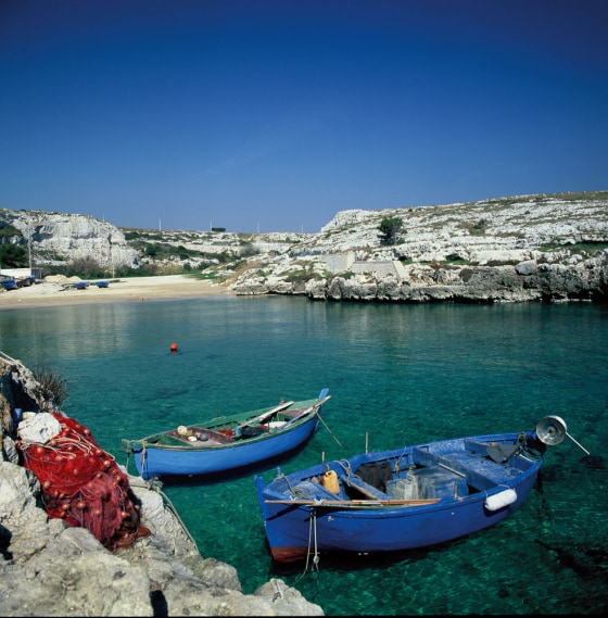 Fishing boats are tied up in Porto Badisco, in southern Italy's Puglia region.