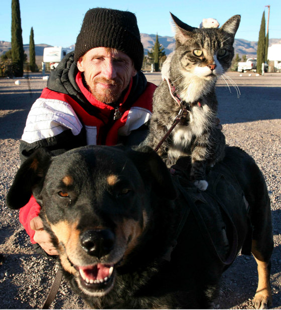 Greg Pike with his dog, cat and mice at his home in Naco, Arizona