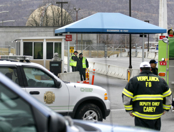 Security officers guard the entrance to the Indian Point nuclear power plant in Buchanan, N.Y., last April 6, when an electrical fault and fire in a transformer yard forced the automatic shutdown of one of the reactors.