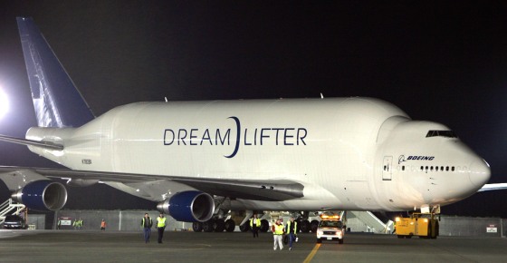 The super freighter "Dreamlifter" aircraft, carrying the massive mid-body fuselage for the first Boeing 787 "Dreamliner," taxis to the unloading area in Everett, Wash, earlier this month. The tail of the specially designed 747 freighter swings open for huge payloads that are unloaded using one of the largest cargo loaders in the world.