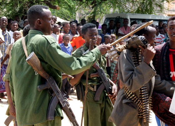 Somali soldiers control the crowd during a World Food Program distribution outside Mogadishu on Sunday.