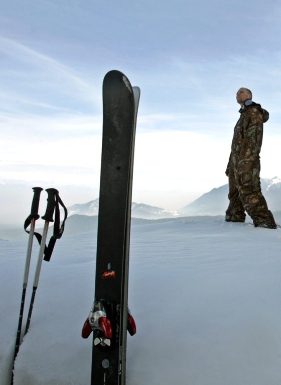 File photo of a Norwegian skier walking past his skis in Gulmarg