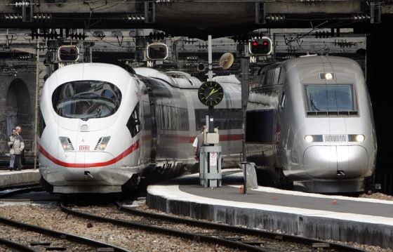 Two high-speed trains one German, left, one French, arrive at the Gare de l'est train station in Paris, May 25. The trains zipped from Germany to France on Friday, marking a crucial step toward a Europe-wide high-speed rail network aimed at competing with air travel.