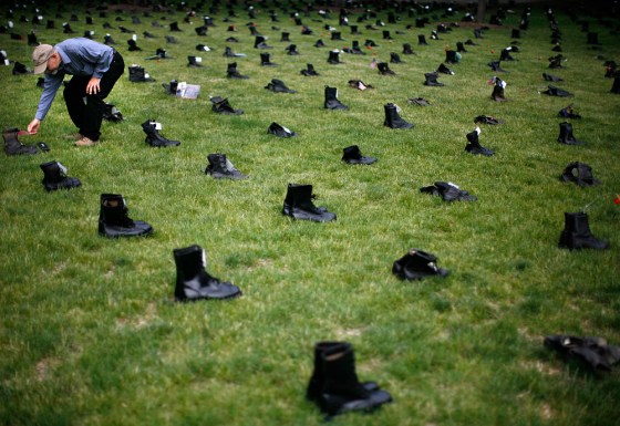 Michael McConnell looks at one of more than 3400 pairs of combat boots in Chicago