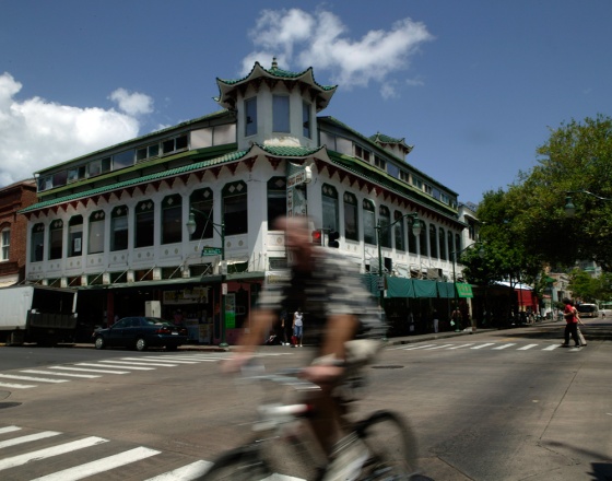 A bicyclist rides past the Wo Fat building in Chinatown, in Honolulu. Shedding a history filled with prostitution, gambling dens and streets plagued by drug dealers, Honolulu's Chinatown neighborhood once walked by the fictional detective Charlie Chan has finally begun to emerge from its dark past. 