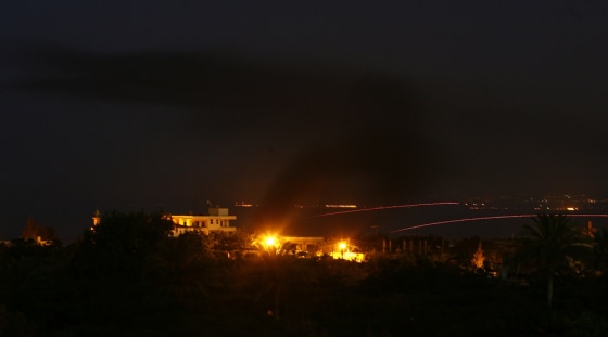 Smoke rises from a house after the Lebanese army attacked the Palestinian Nahr al-Bared refugee camp in Lebanon