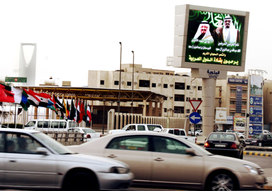 A billboard showing Saudi King Abdullah bin Abd al-Aziz and Crown Prince Sultan bin Abdul Aziz, symbols of the old monarchy, abut a square with bustling traffic in downtown Riyadh. Saudi Arabia is embracing Western ideas it likes, while rejecting anything it feels could shake its conservative Islamic values.