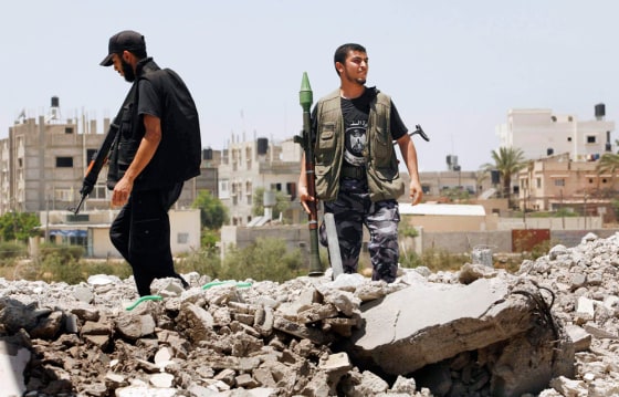 Members of the Hamas security force take up position in a street in the southern Gaza strip
