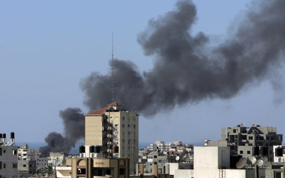 Smoke bellows from a building in Gaza Ci