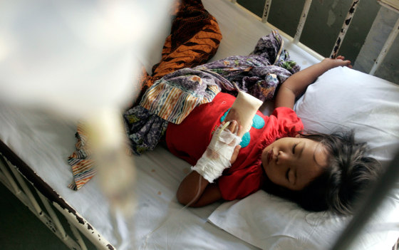 An Indonesian child suffering from dengue fever sleeps at the government-run hospital in Jakarta
