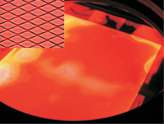 Photograph of an aluminum foil lamp having a radiating area of 225 square centimeters. The inset is a magnified view of several diamond-shapes microcavities.