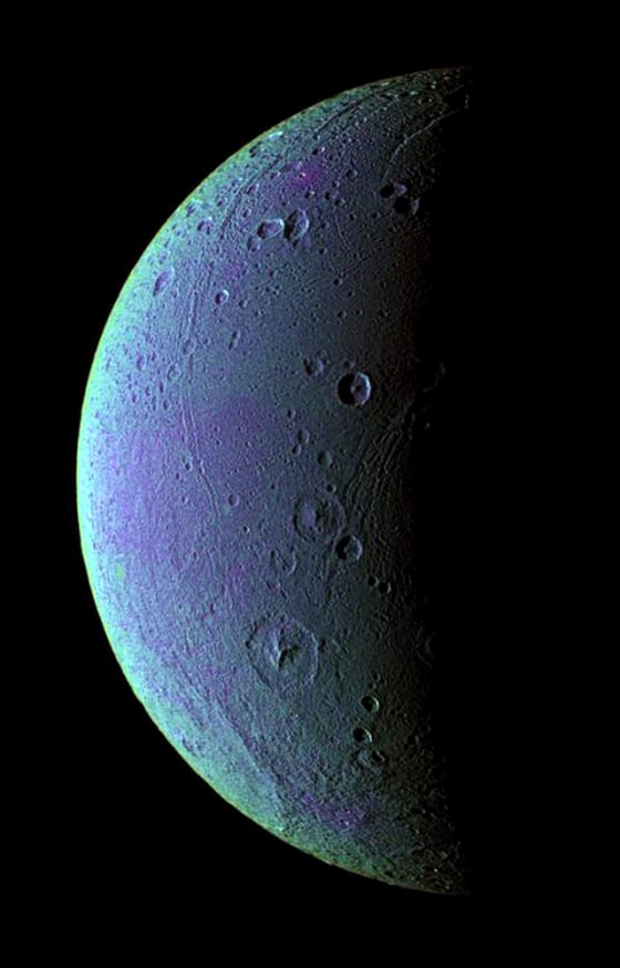 Tectonic faults and craters on Saturn's icy moon Dione are revealed in this color-enhanced image that mixes infrared, ultraviolet and green light observations. The color variations might be caused by subtle differences in the surface composition or the sizes of grains making up the icy soil, but scientists aren't sure. 