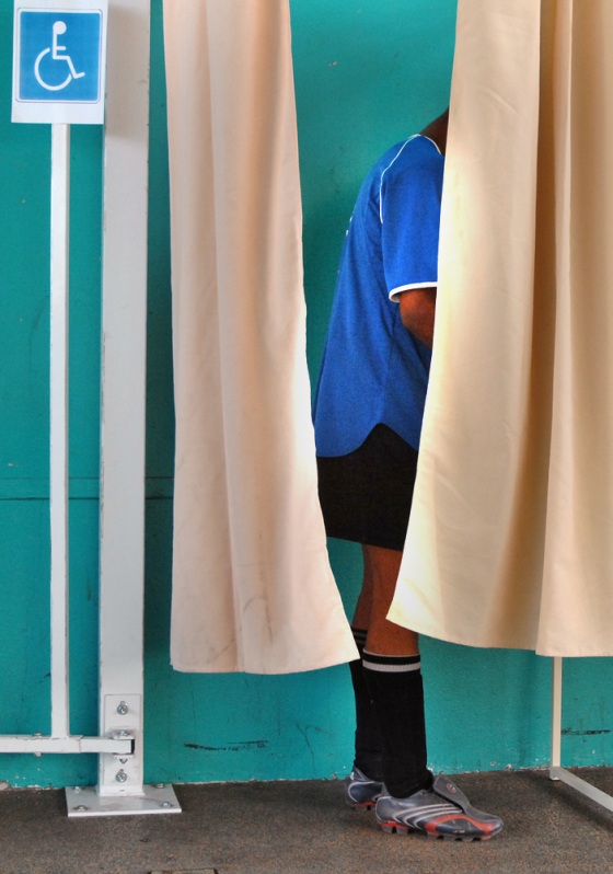 A soccer player in Argentueil, a northern Paris suburb, casts his ballot Sunday, in the second round of the French parliamentary elections. 