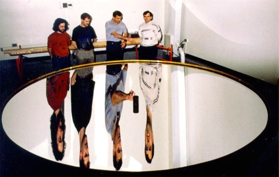 The picture shows a 3.7-m diameter liquid mirror at Laval University. The liquid is mercury.