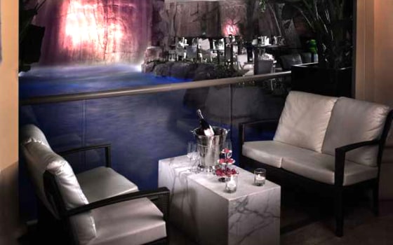Tryst boasts a 90-foot waterfall and a lagoon-themed atmosphere. Since it's a partially open-air club, the outside breeze gives the dancers at Tryst a little extra lift. The most desirable tables are those on the dance floor, near the obligatory stripper pole and outside by the waterfall.