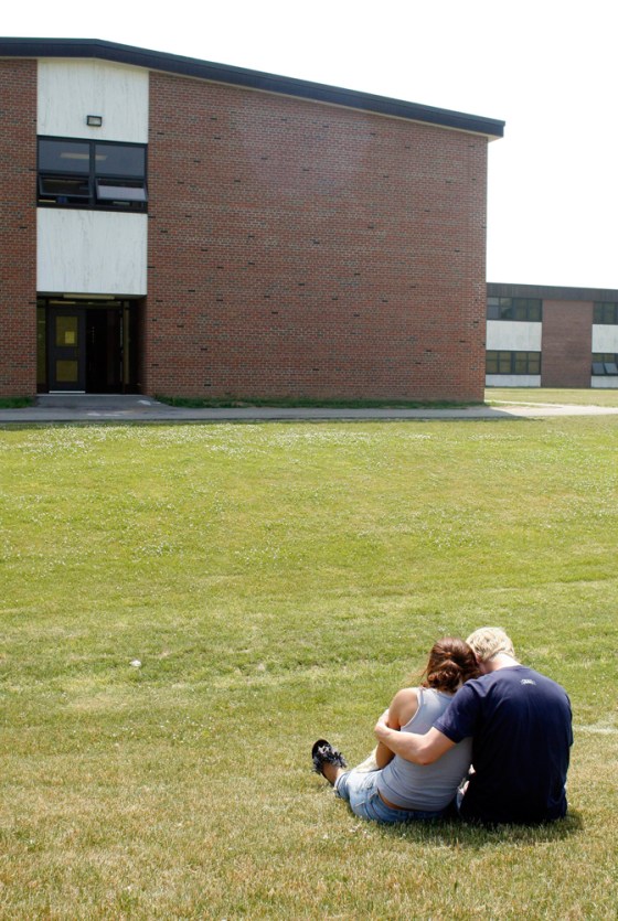 Keisha Koneski, right, is comforted by her boyfriend Mike Danylyshyn, both recent graduates of Fairport High School, on Wednesday after five of their friends, also recent graduates, were killed in a car accident.