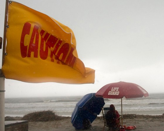 A caution flag warns swimmers as wind and rain from Subtropical Storm Andrea invade Dreissen Beach on Hilton Head Island, S. C., Wednesday, May 9, 2007. Andrea formed Wednesday off the southeastern U.S. coast, more than three weeks before the official start of the Atlantic hurricane season, forecasters said. (AP Photo/Gerald Weaver)