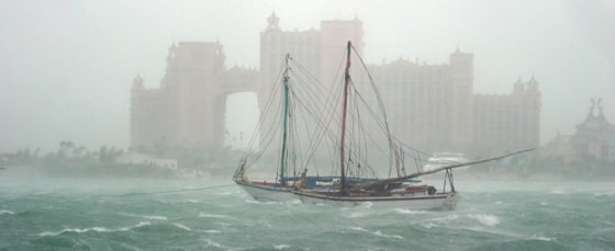 Haitian sloops rock around in rough seas in front of the Atlantis Paradise Island resort Friday, Sept. 3, 2004 as Hurricane Frances passes close to the island of New Providence in the Bahamas. A group of Haitians were forced to flee their sailing vessel in the harbor and take refuge on land after encountering problems on the boat. (AP Photo/Tim Aylen)