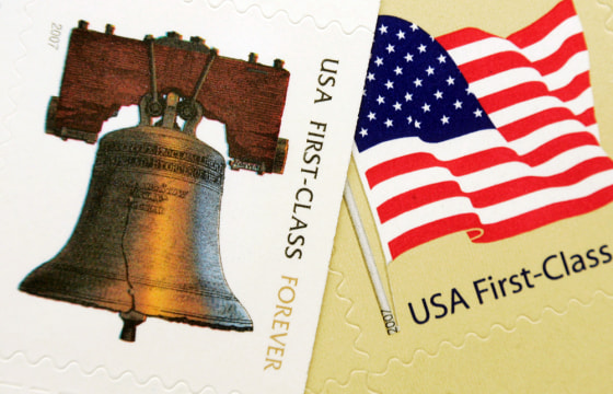 The "forever" stamp, left, that features a likeness of the Liberty Bell, appears next to the new 41 cent first-class flag stamp.