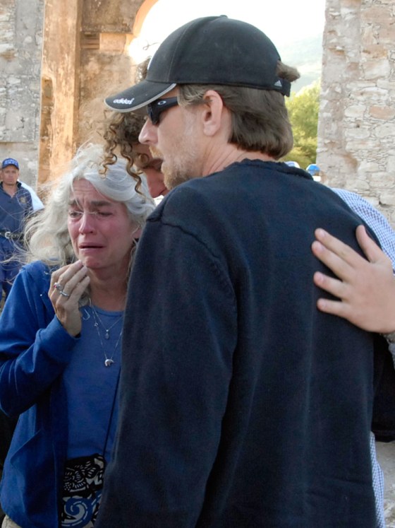 Sue Paterson, left; Christopher Crane, right, and an unidentified person, center, grieve in San Luis de la Paz, Mexico, Saturday, near an abandoned mine where Paterson's and Crane's son 16-year-old Taylor Crane fell to his death on Friday.