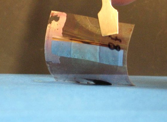 A plastic sheet is coated with polymers that catch the sun's rays and converts them into electricity. 