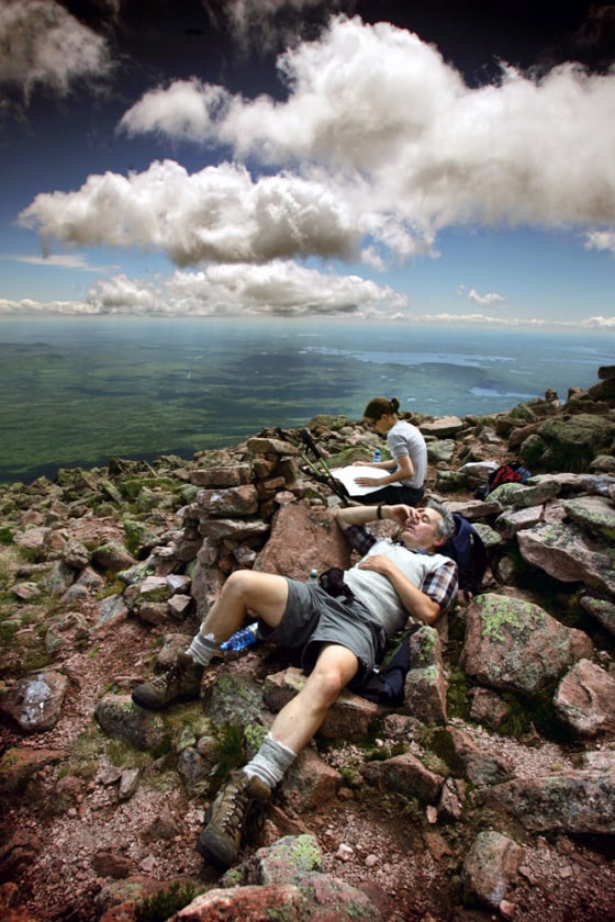 Visitors relax at the Pomola summit on Mount Katahdin, in Baxter State Park, Maine.
