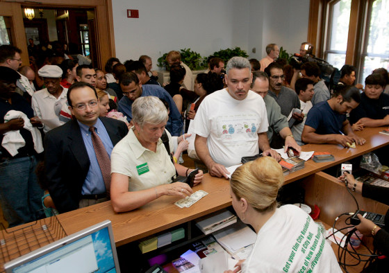ID card applicants crowd an office at City Hall in New Haven, Conn., on Tuesday.