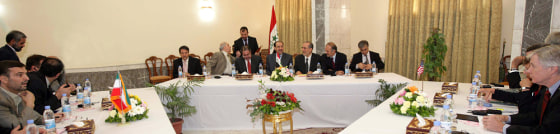 Iran's ambassador to Iraq Hassan Kazemi-Qomi meets his U.S. counterpart Ryan Crocker in Baghdad