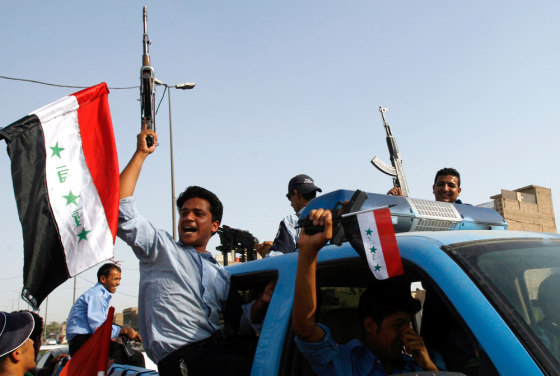 Iraqi soccer fans celebrate in the streets of Sadr City, a Shiite neighborhood in Baghdad, on Wednesday, before suicide bombers took at least 50 lives during celebrations in the city.