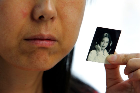 Liu Chang holds a picture of her formal self, next to an egg-sized lump in her cheek, the result of an injection that was supposed to make her prettier. Lawers afraid to take on powerful business interests wouldn't take her case, but she's now suing.