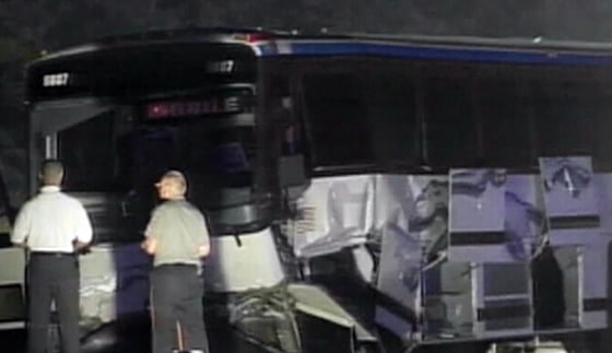 Emergency personnel arrive at the scene of Friday morning's Greyhound bus-SUV crash in Alabama.