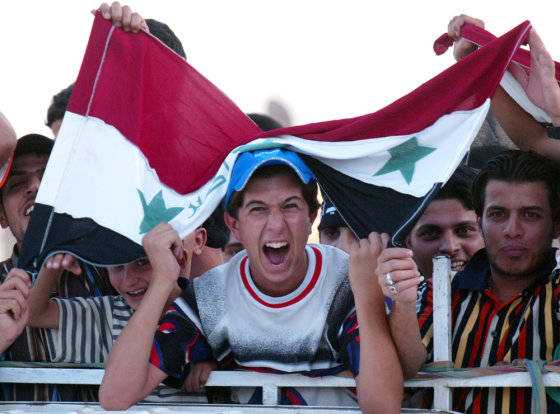 Residents of Baghdad's impoverished Sadr City celebrate after the Iraqi soccer team defeated Saudi Arabia to clinch its first Asian Cup championship on Sunday.