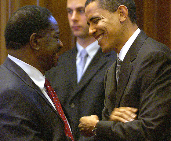 Emil Jones, left, the Illinois Senate president, talks with Barack Obama as the latter says goodbye to his colleagues after his election to the U.S. Senate in 2004.