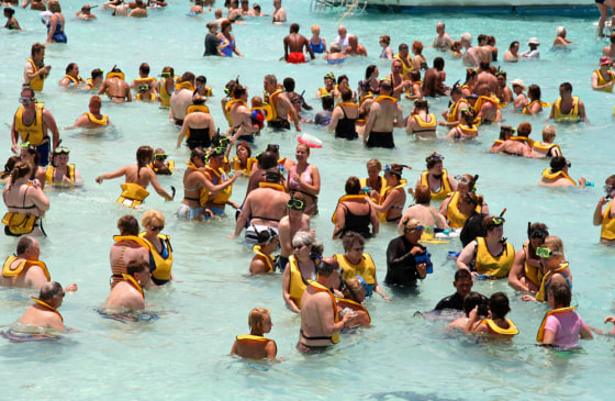 Six or seven megaships bobbing offshore is business as usual during high season at Cayman's capital, George Town.