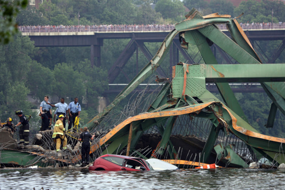 Emergency personnel work at the scene of a bridge collapse Wednesday in Minneapolis.