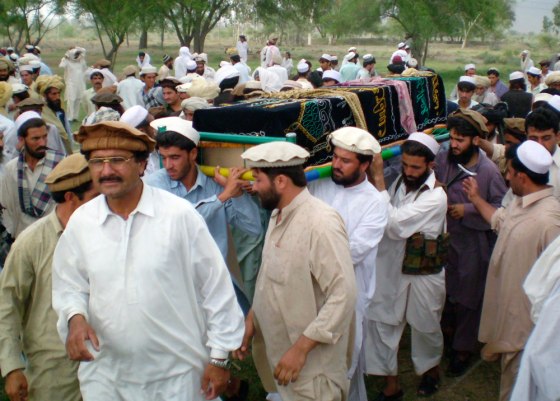 Tribesmen carry coffin of militant for burial after he was killed during clashes with security forces in Miranshah