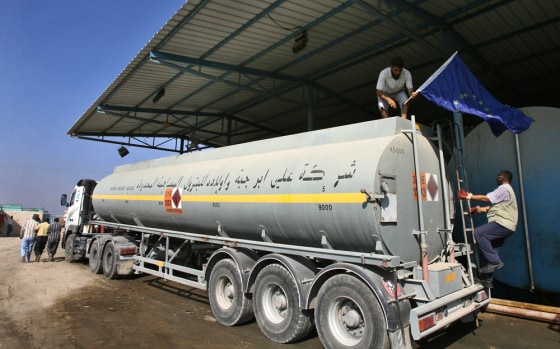 A European Union flag is placed on a fuel tanker on the Palestinian side of a border crossing from Israel into the Gaza Strip on Wednesday, as EU fuel shipments to the Mediterranean coastal strip resumed.