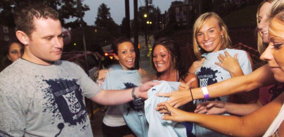 West Virginia University senior Adam Gibson passes out free t-shirts from PlayboyU.com in Morgantown, W.Va. PlayboyU is a social networking Web site dedicated&nbsp;to college students.